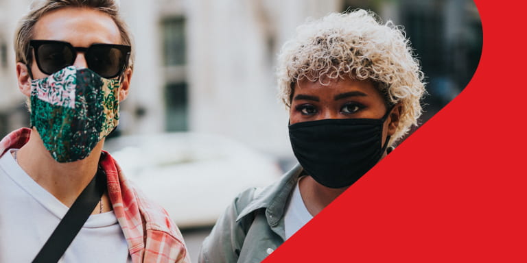 A man and a women wearing masks during Covid-19 pandemic.