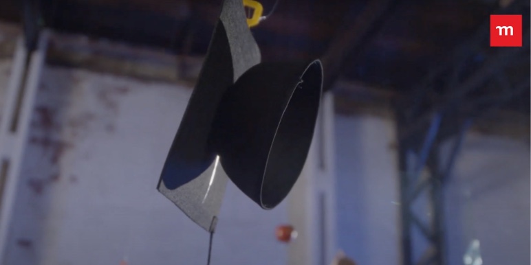 Various educational items, such as a graduation hat hanging from the ceiling of a room.