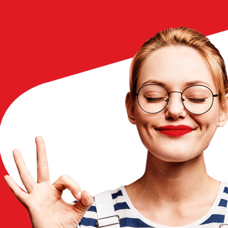 Young woman with glasses pulling an expression of satisfaction with her index fingers and thumbs joined.