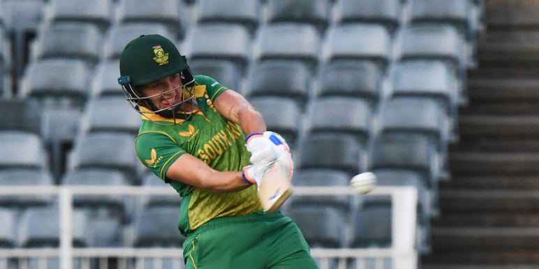 A Momentum Proteas Women cricketer in an action shot hitting the ball.