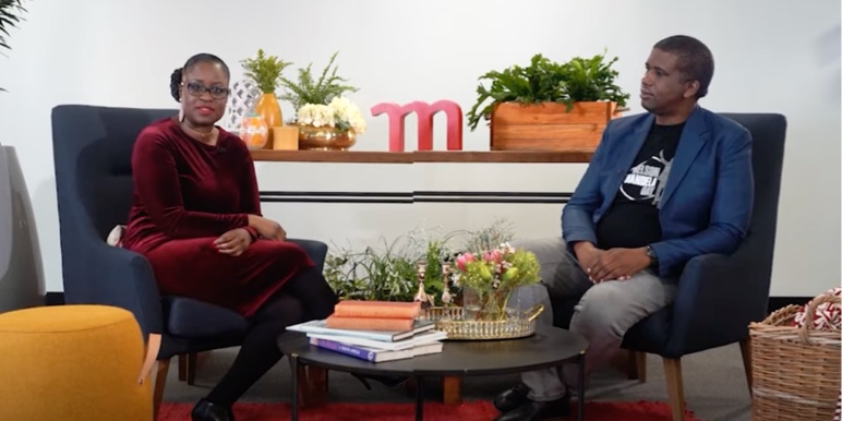 A video thumbnail of two black women in conversation on an interview set.