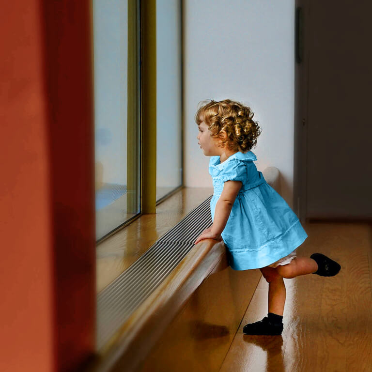 Toddler in blue dress looking out the window to symbolise looking ahead at the prospect of a bright financial future.  