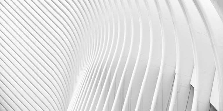 A futuristic wall of sweeping white lines and sinuous curves.