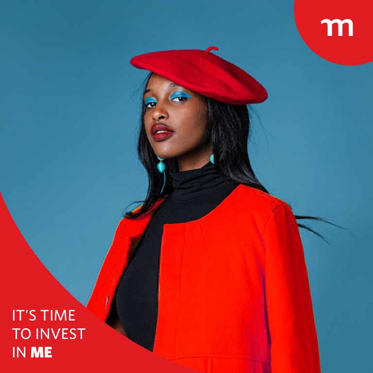 Young black women wearing a red beret and blazer looking forward boldly