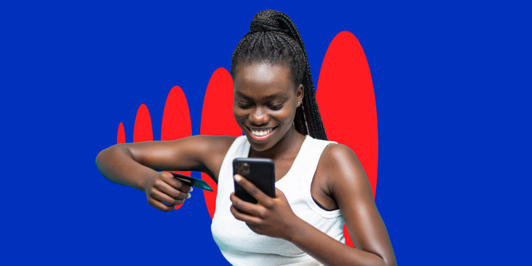 A young woman looks happy as she looks at her cell phone and sees the Multiply points she’s earned.
