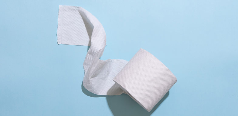 White toilet paper against a blue background.